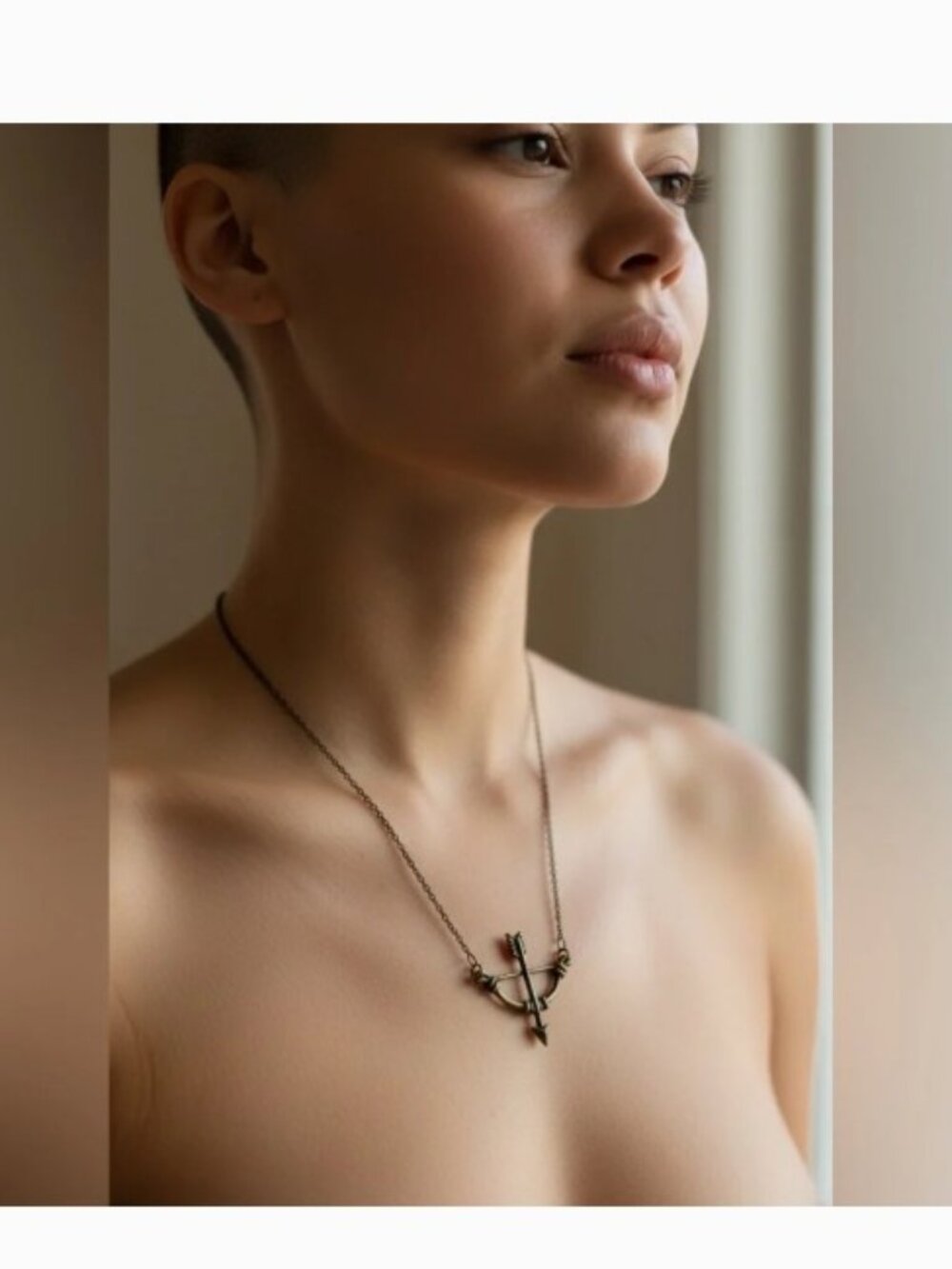 Delicate Crossbow Pendant Necklace in Antique Bronze